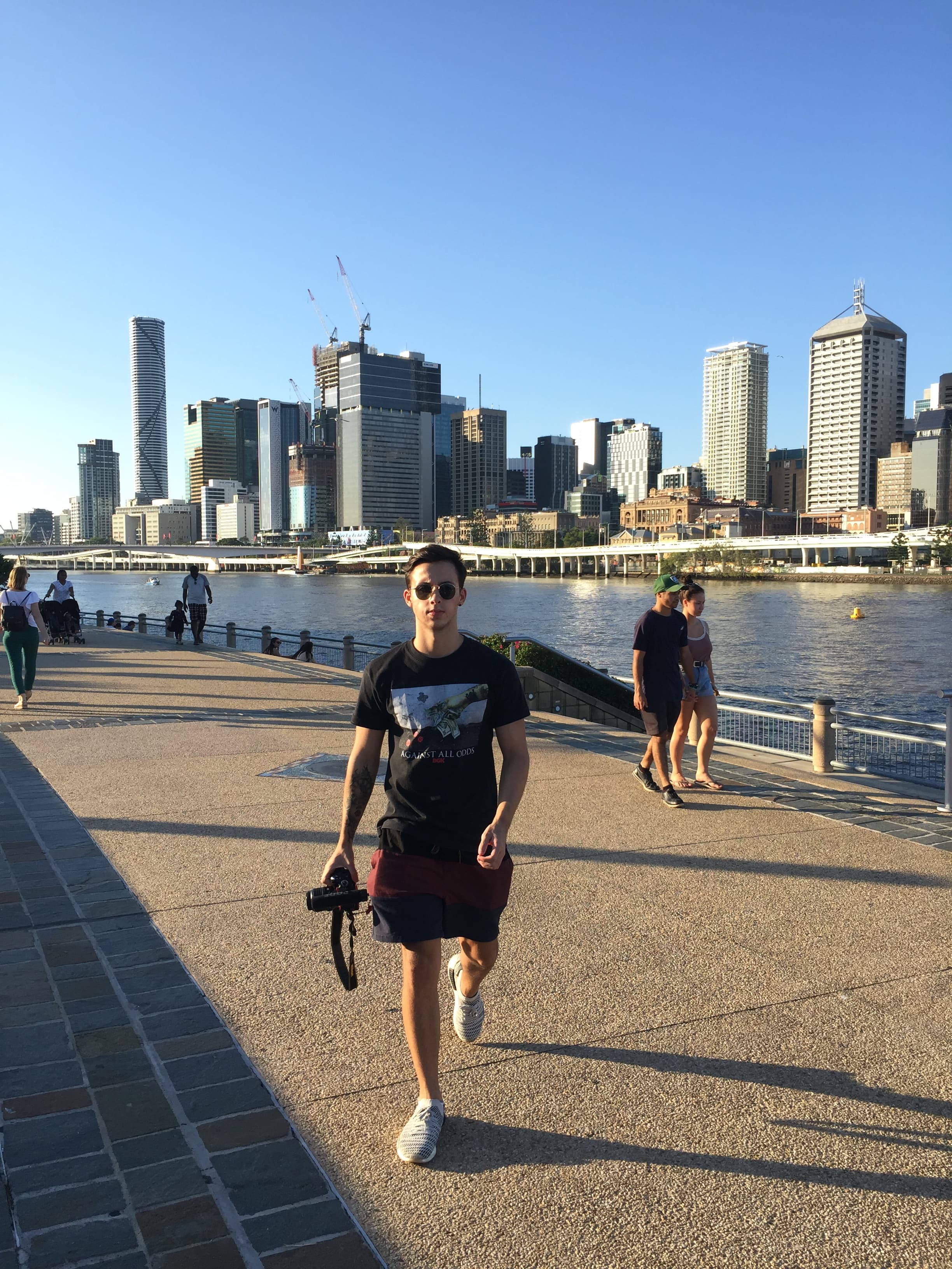 Arthur carrying his first DSLR camera in Brisbane