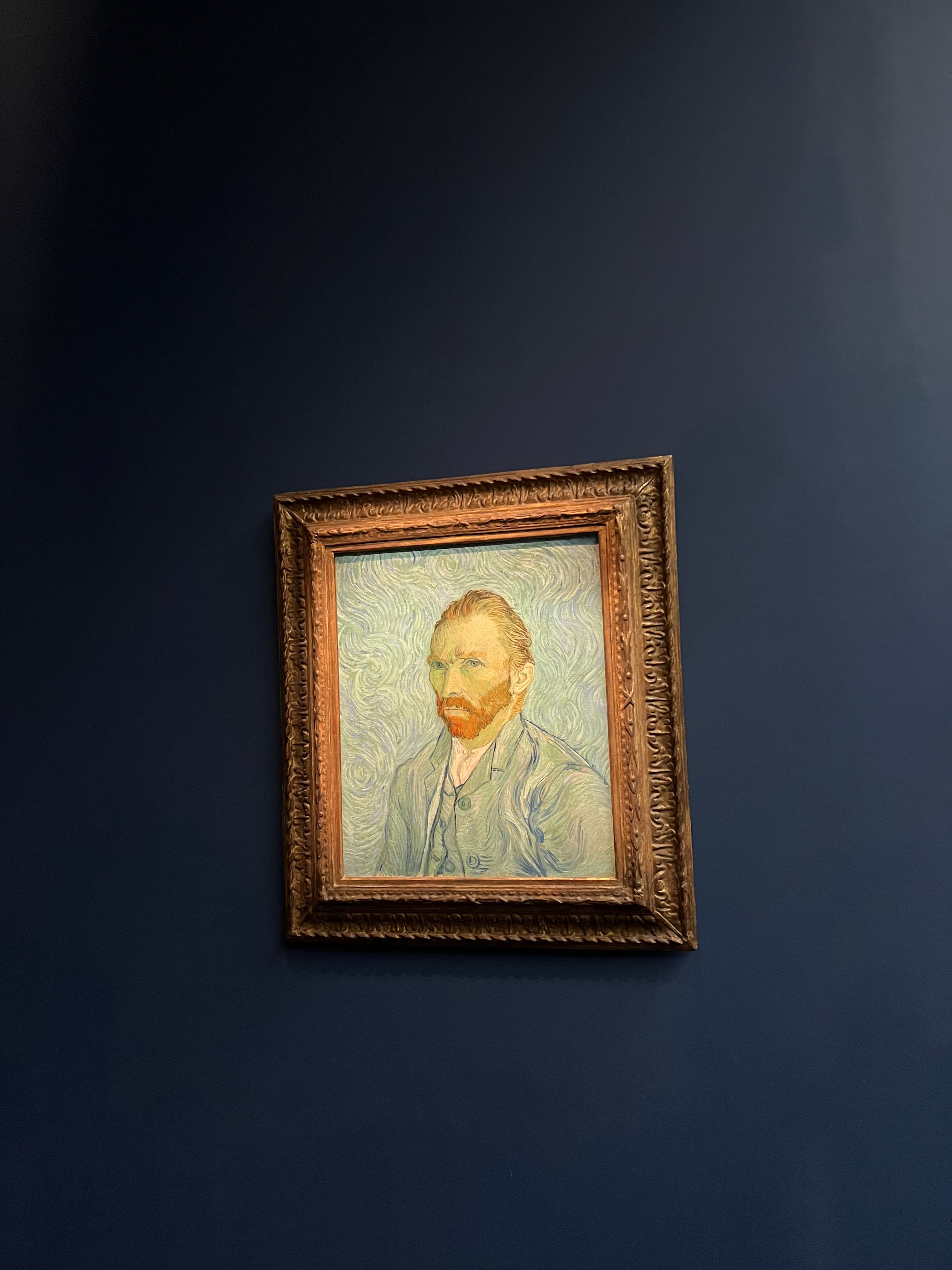 A Van Gogh self-portrait displayed in a museum